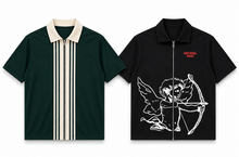 Load image into Gallery viewer, Two short-sleeve collared zip-up shirts shown flat against a white background: a dark green shirt with cream vertical stripes and a cream collar, and a black shirt with a white cupid graphic, a red 'EMOTIONAL APE' logo, and a black zipper.